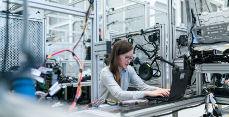 photo of female engineer working on her workspace